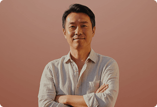 Smiling man with his arms crossed
